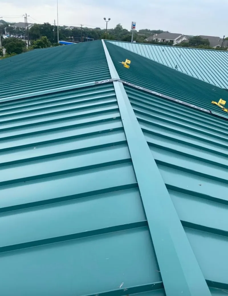 Green commercial metal roof ridge and valley for Metal Roof Repair in Buxton